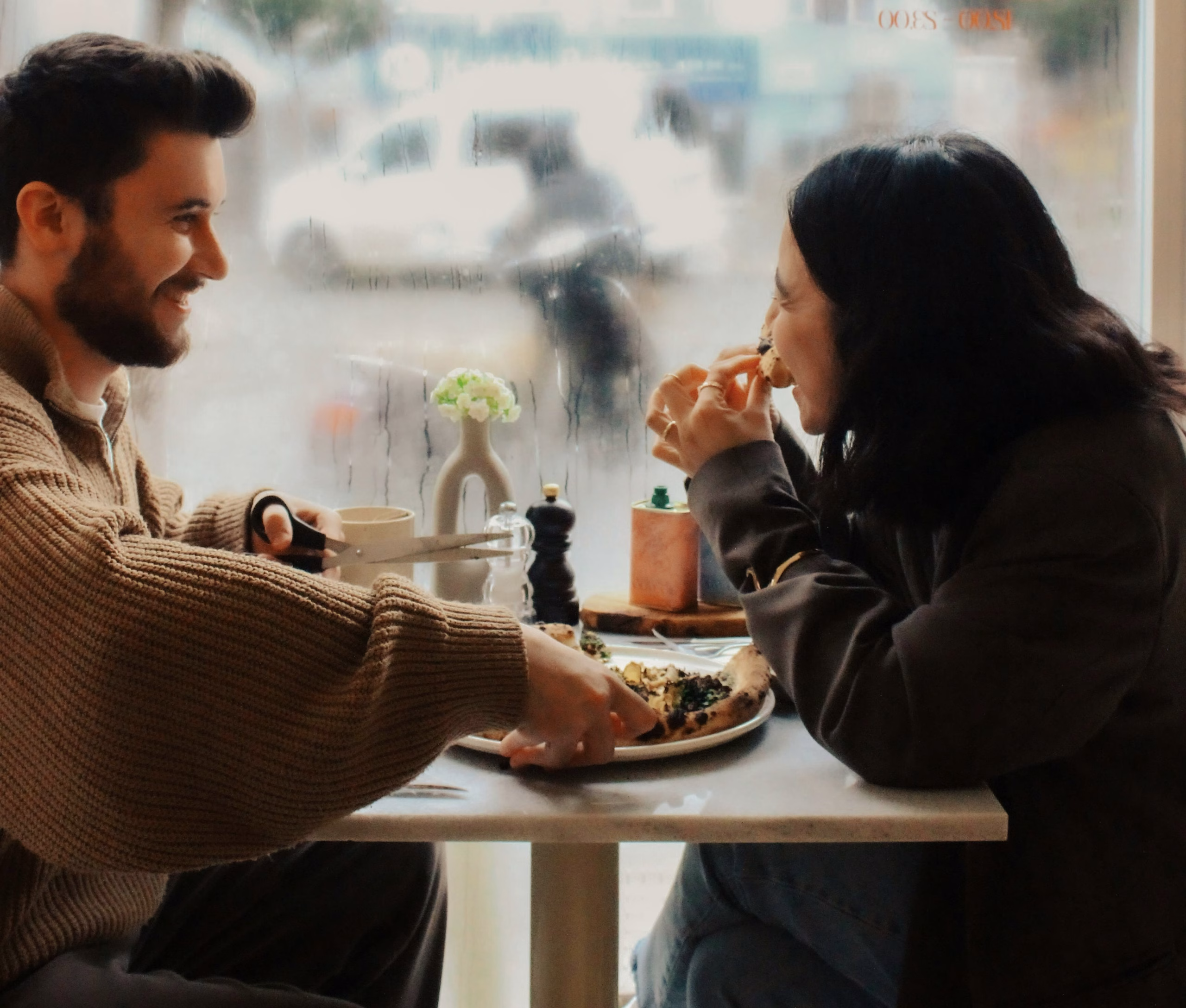 Couple calmly discussing feedback with openness and connection